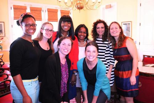 Aja Brown poses with the USC Price Women and Allies